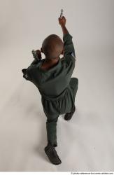 ERIC KNEELING POSE WITH GUNS